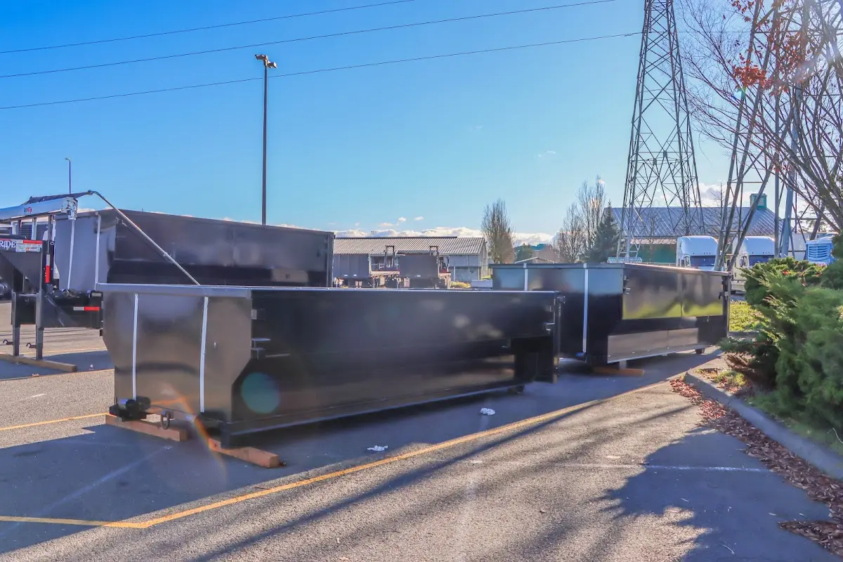 Roll-off dumpster ready for waste disposal at job site for Concrete Dumpster Rental in Hampden